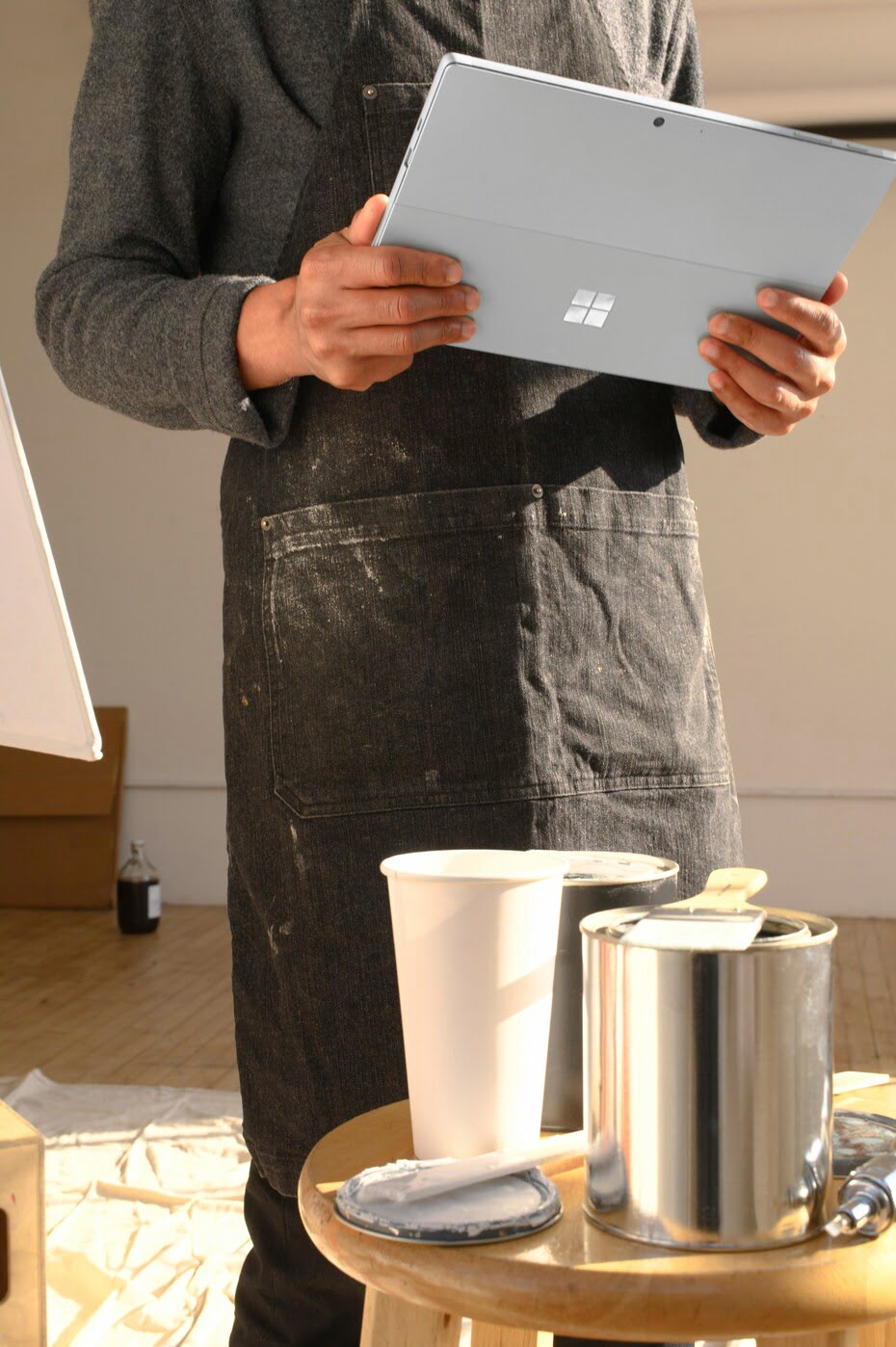 Self-employed painter using tablet, symbolising the question - do I need a website for my small business.